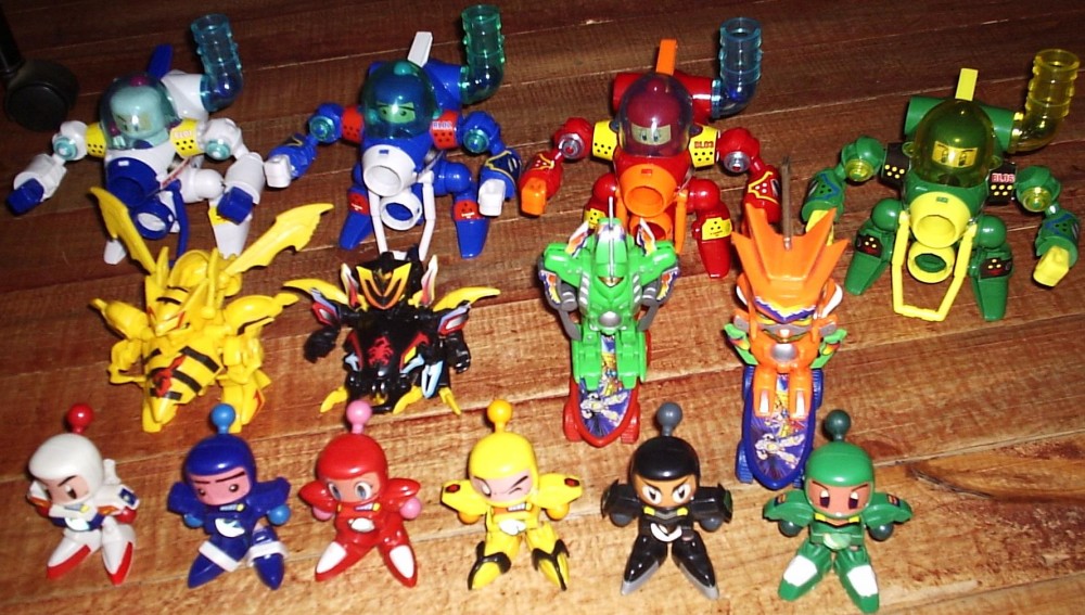 Front: Shirobom (Bomberman, the white with blue accents one, the main character) Aobom (Blue, the shy genius) Akabom (red, the pretty gal) Kiirobom (Yellow, always wanting money and women), Kurobom (Black, a mysterious character who tends to appear suddenly and help the other Bombers), Midoribom (Green,  a soldier with a military mind)<br />behind them: The &quot;Bee&quot; and &quot;Scorpion&quot; Bombers are some baddies (I think the scorpion's name is &quot;Aku Manto&quot;), I haven't identified the skateboarders.<br />Back: Shiro, Ao, Aka and Midori in Mech armors (the figures are detachable, but smaller than the front ones).