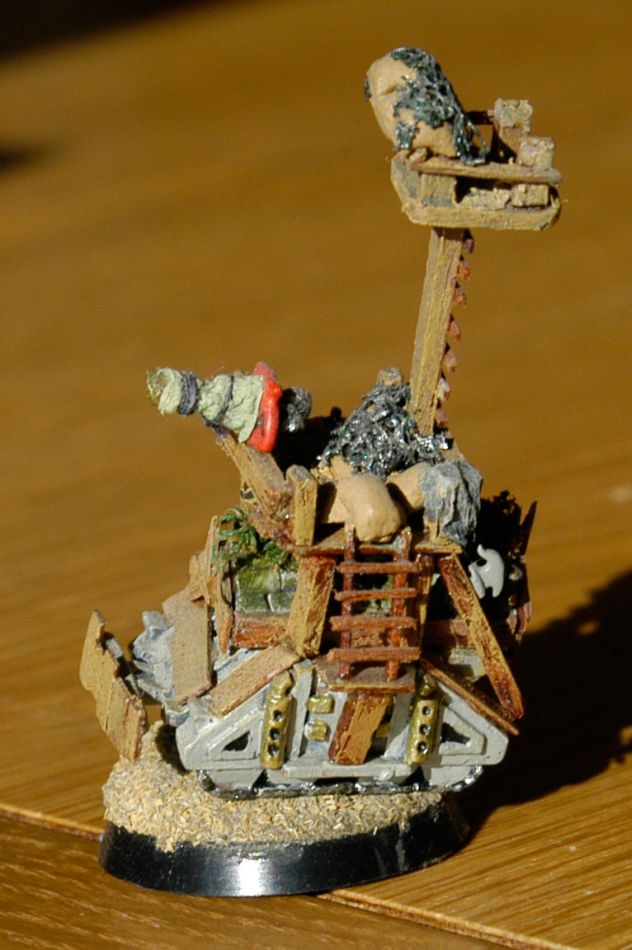 My favourite.  An Ork Battlewagon custom of a Rhino tank.  This was modelled from one in the Games Workshop painting awards in the year I made it, although the original was in the standard size, which I miniturised