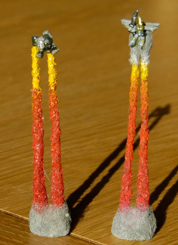 Space Marine and Eldar rocket packs in flight